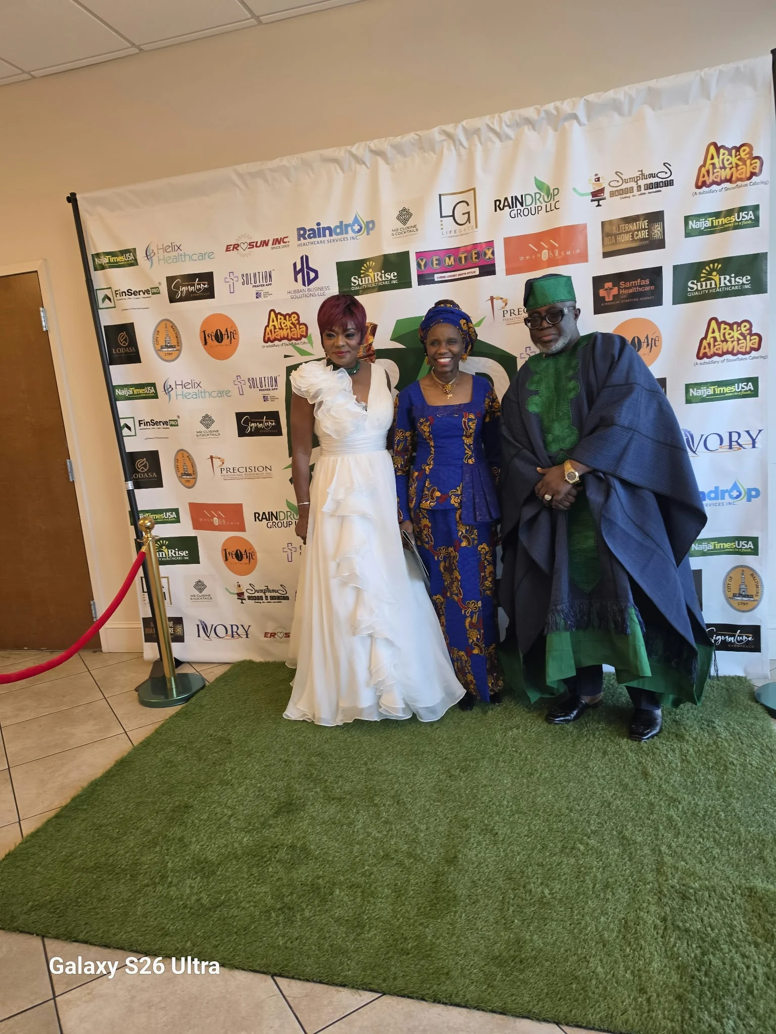 Attendees posing together at the NIBAD event backdrop.