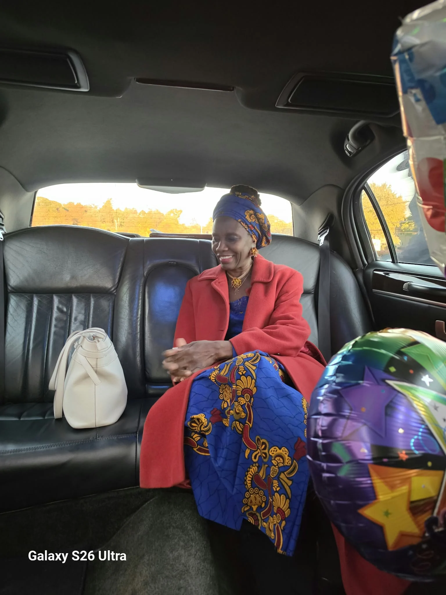 A candid moment with Dr. O seated in a vehicle.